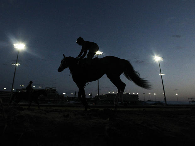 Horses workout before the sun come up at Churchill Downs  