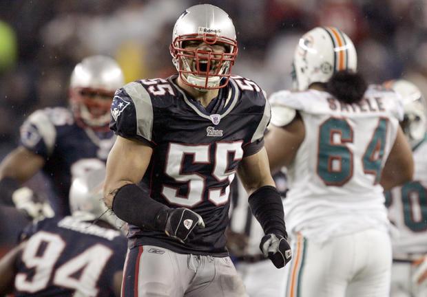 Junior Seau reacts after a defensive play  