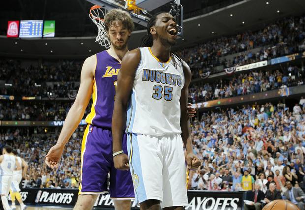 Kenneth Faried reats after scoring a basket 