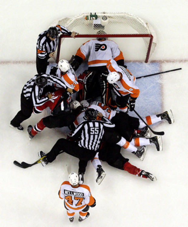 Ilya Bryzgalov lays on his back after making a save  