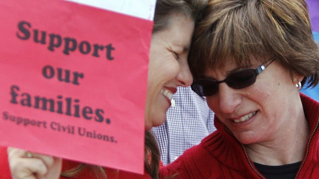 Anna Simon, left, and Fran Simon embrace at a rally in support of Civil Unions 