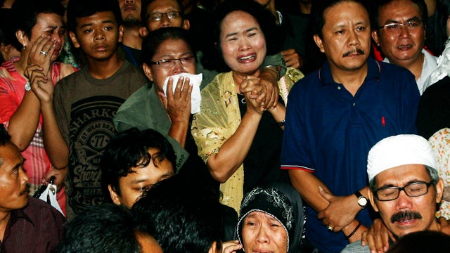 Relatives of the passengers of a Sukhoi Superjet-100 that crashed into a mountain in West Java, Indonesia, react to the news at Halim Perdanakusumah airport in Jakarta, Indonesia, May 11, 2012, that rescuers have found dead bodies. 
