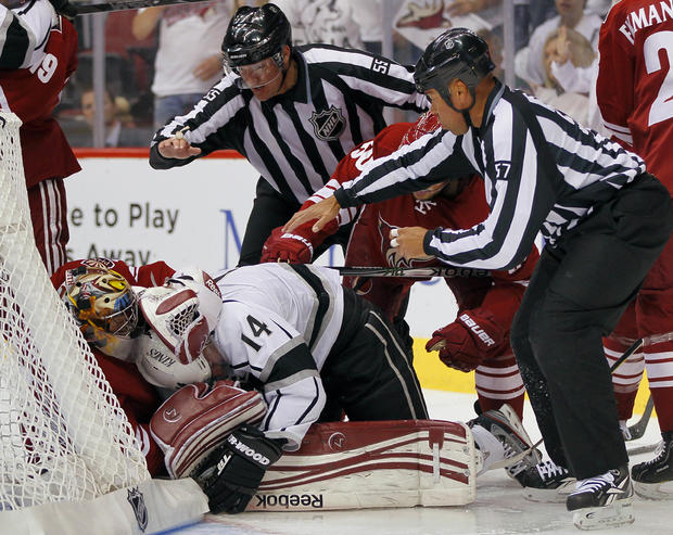 Mike Smith pulls down Justin Williams  