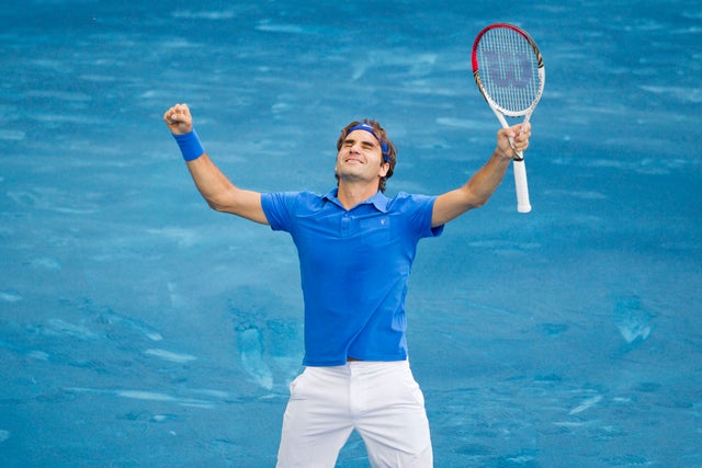 Roger Federer celebrates after defeating Tomas Berdych 