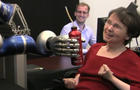 Paralyzed woman operates robotic arm 
