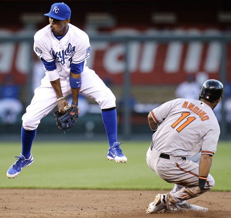 Robert Andino beats the tag by Alcides Escobar 