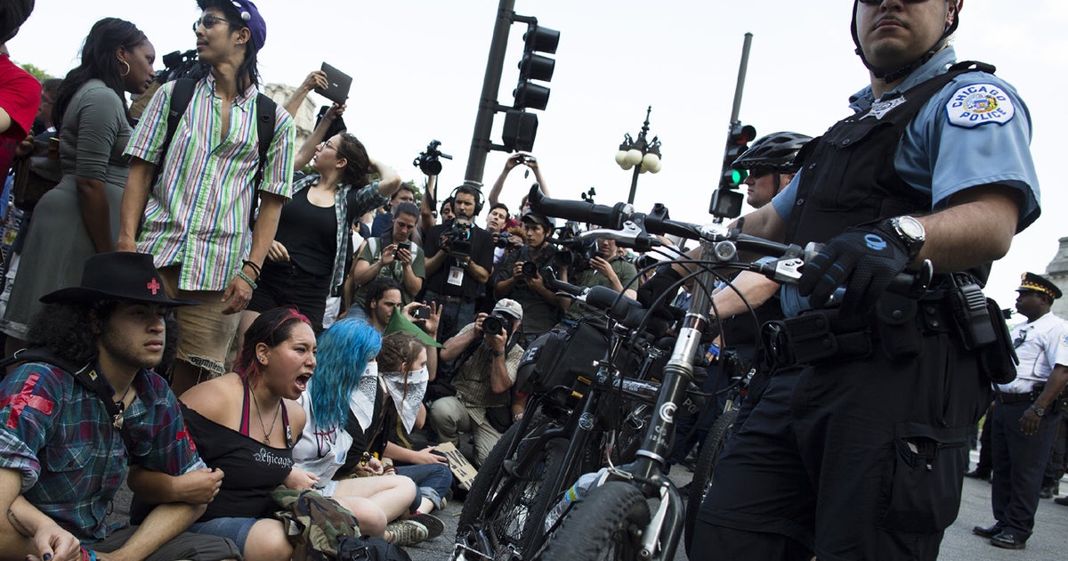 2 more NATO Summit activists charged - CBS News