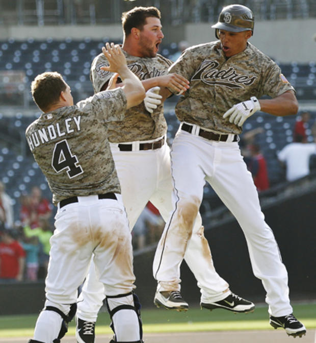 Will Venable celebrates with Yonder Alonso and Nick Hundley 
