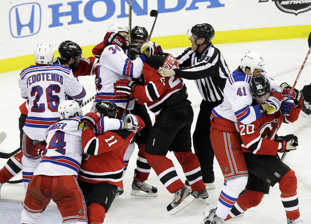 New York Rangers players fight with New Jersey Devils players 