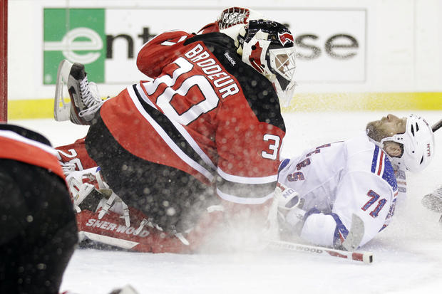 Mike Rupp falls back while attacking Martin Brodeur  