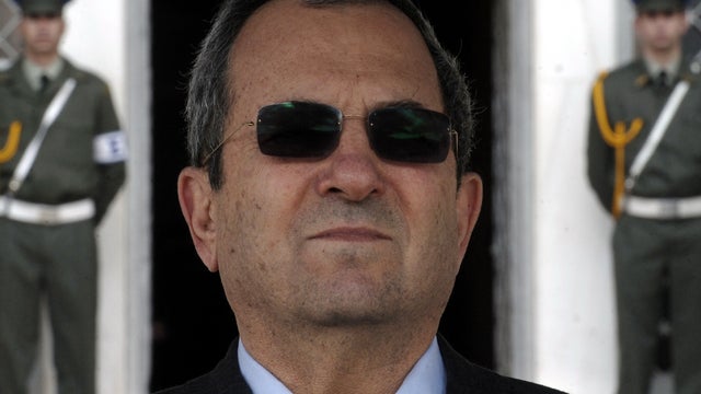 Israeli Defense Minister Ehud Barak reviews a military honor guard during a welcoming ceremony in Athens, Greece, Jan. 10, 2012. 