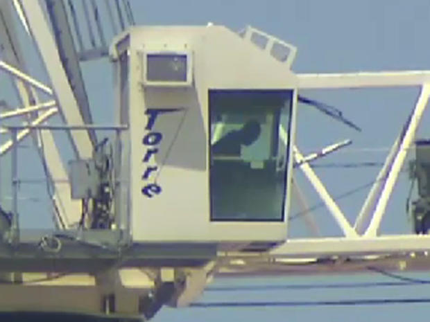 Dallas cops in standoff with man in crane at SMU 