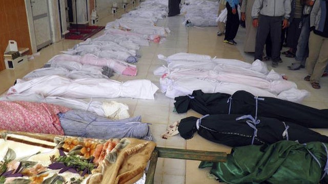 Bodies from alleged Syrian government assault in Houla 