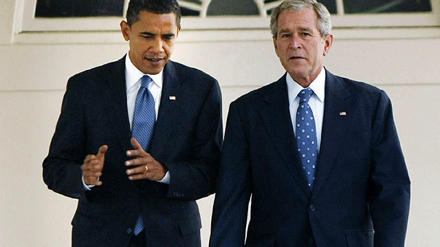 In this Nov. 10, 2008 file photo, President George W. Bush walks with President-elect Barack Obama down the Colonnade of the White House in Washington.  