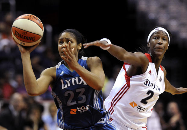 Maya Moore shoots away from Michelle Snow 