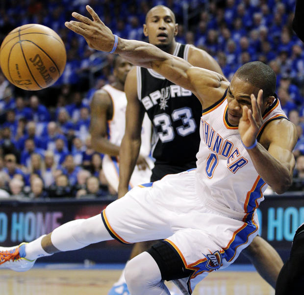 Russell Westbrook tries to pass as he falls while Boris Diaw watches 