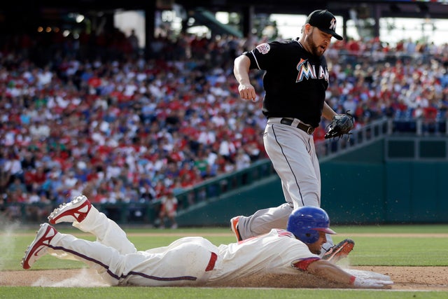 Shane Victorino dives to first base for an infield single 