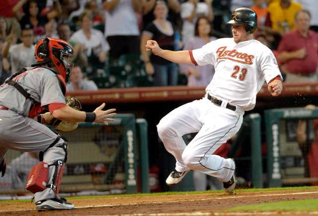 Chris Johnson slides into home plate 