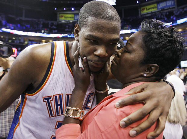 Kevin Durant is embraced and kissed by his mother 