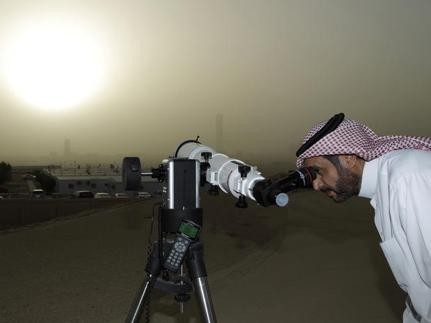 A Saudi man uses a special telescope to observe the transit of Venus 