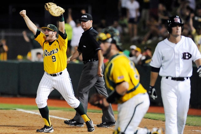 Max Muncy reacts as catcher Josh Ludy runs to the mound 