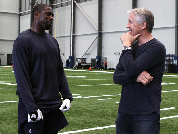 Brian Banks, left,  and Seattle Seahawks head football coach Pete Carroll 