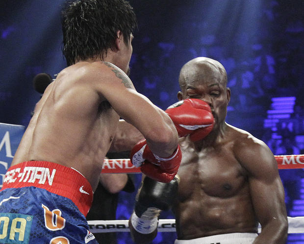 Manny Pacquiao lands a punch to the face of Timothy Bradley 