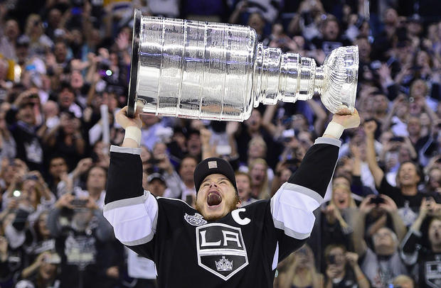 Dustin Brown holds up the Stanley Cup  