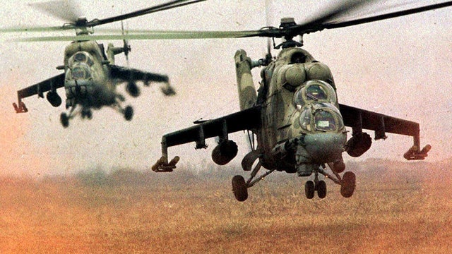 Russian Mi-24 helicopter gunships kick up dust near Urus Martan, Chechnya, Dec. 7, 1999. Syria has received dozens of Soviet-built Mi-8 transport helicopters and Mi-24 helicopter gunships since the Cold War, with the last deliveries taking place in the 19 