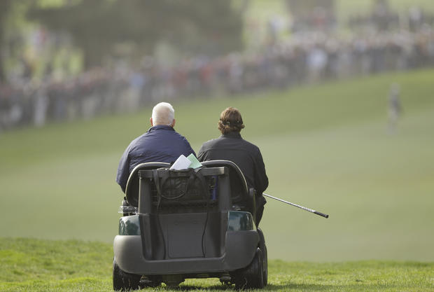 Phil Mickelson gets a ride in a cart  
