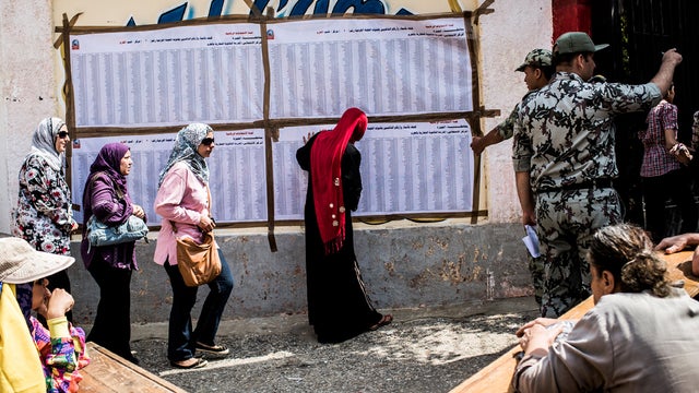 Egyptian women line up to cast their vote Saturday at polling station in Giza 