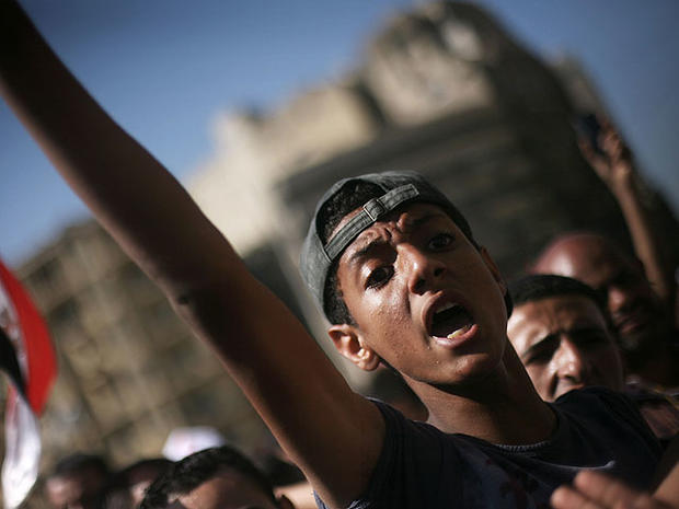 An Egyptian protester chats anti-Supreme Council for the Armed Forces (SCAF) slogans in Tahrir Square, Cairo, Egypt, June 21, 2012. 