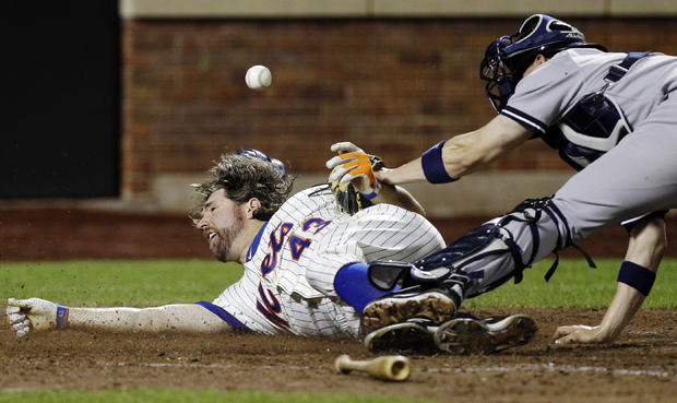 R.A. Dickey is safe sliding home  