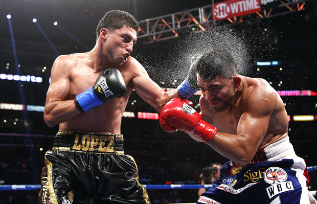 Victor Ortiz takes a punch from Josesito Lopez 