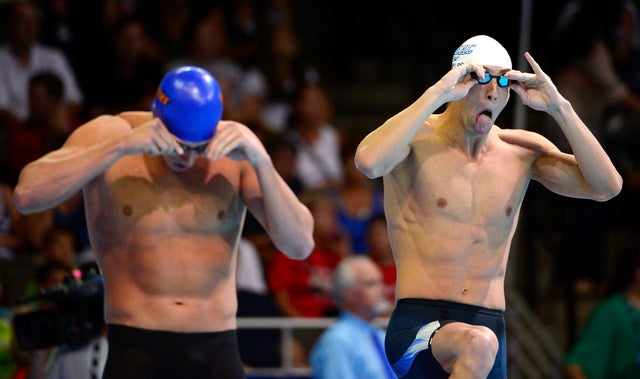 Ryan Lochte, left, and Michael Phelps prepare to swim 