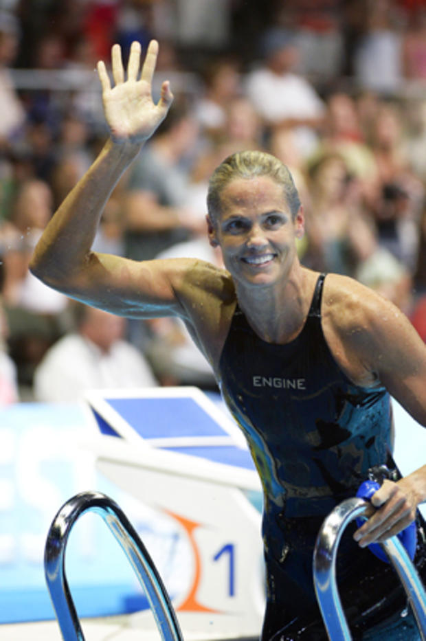 Dara Torres waves after swimming in the women's 50-meter freestyle semifinal 