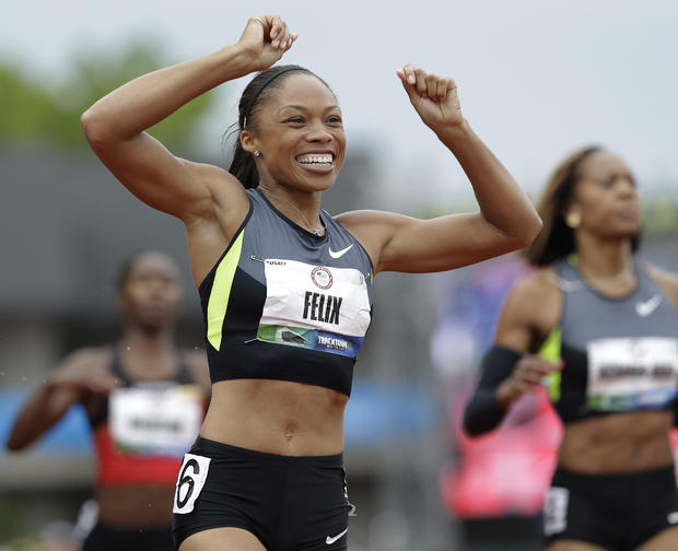 Allyson Felix celebrates her first place finish  