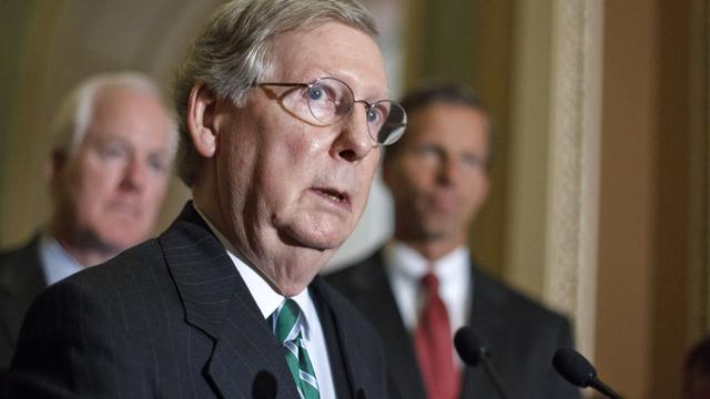 In this June 26, 2012 file photo, Senate Minority Leader Mitch McConnell, of Ky., center, accompanied by Sen. John Cornyn, R-Texas, left, and Sen. John Thune, R-S.D., speaks to reporters outside the Senate, on Capitol Hill in Washington. 