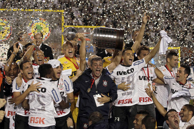 Brazil's Corinthians' team members celebrate at the end of the Copa Libertadores final soccer 