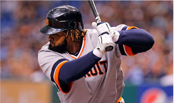 American League's Adam Jones of the Baltimore Orioles hits a sacrifice fly  to score Curtis Granderson of the Detroit Tigers during the eighth inning  of the MLB All-Star baseball game in St.