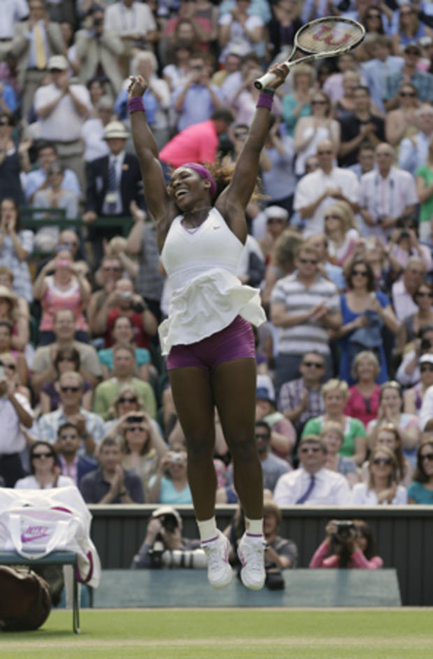 Serena Williams reacts as she defeats Victoria Azarenka 