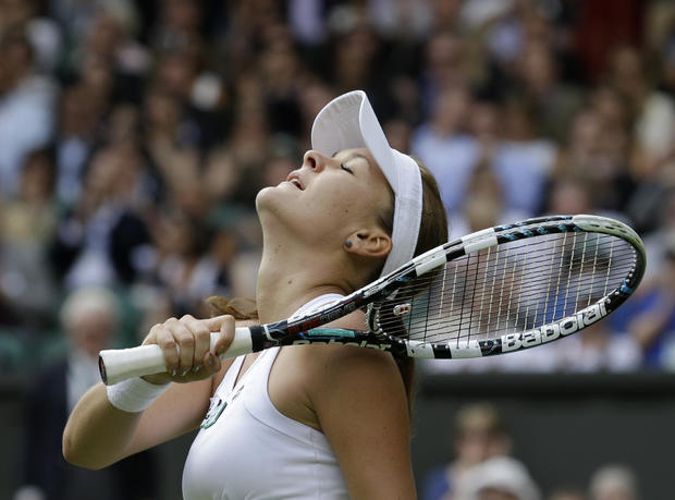 Agnieszka Radwanska reacts as she wins a semifinals match against Angelique Kerber 