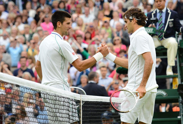 Roger Federer shakes hands with Novak Djokovic 