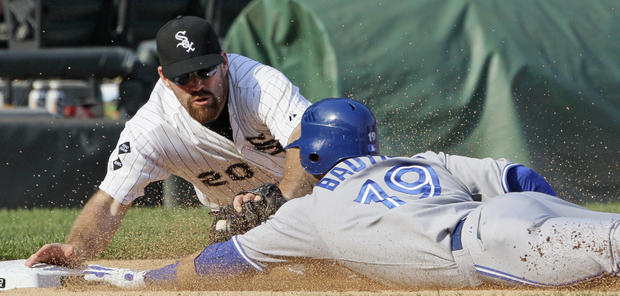 Kevin Youkilis tags out Jose Bautista 