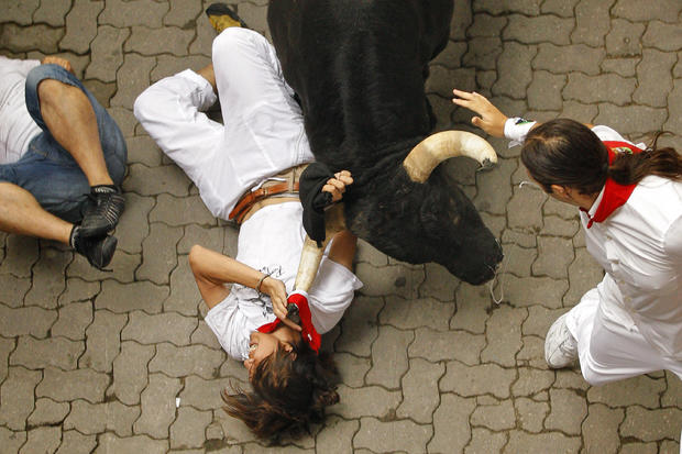 A reveler is tossed by a Dolores Aguirre Yabarra ranch fighting bull  