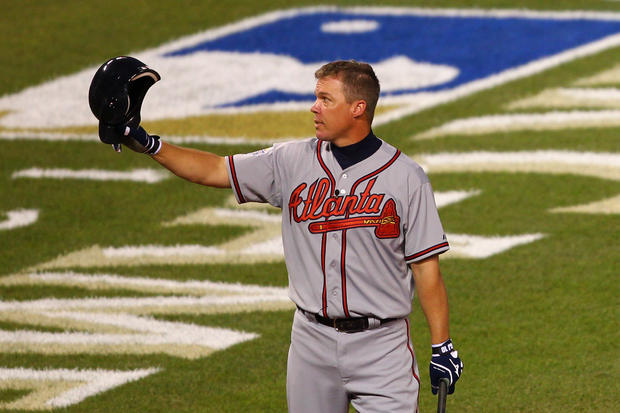 Chipper Jones takes off his helmet and waves to the crowd 