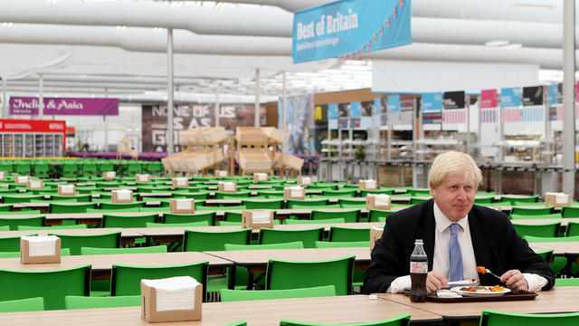 London Mayor Boris Johnson poses for photographers in the dining area of the London 2012 Olympic Athletes Village on July 12, 2012.  