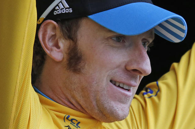 Bradley Wiggins wearing the overall leader's yellow jersey 