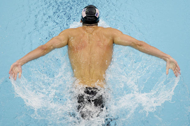 Michael Phelps swims on his way to winning the men's 200-meter butterfly  