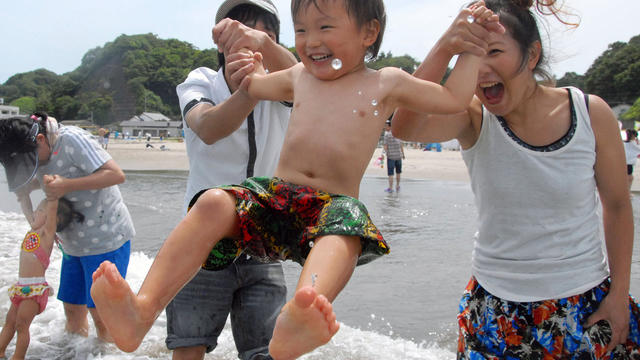 A family plays on Nakoso beach in Iwaki, Fukushima prefecture, Japan 